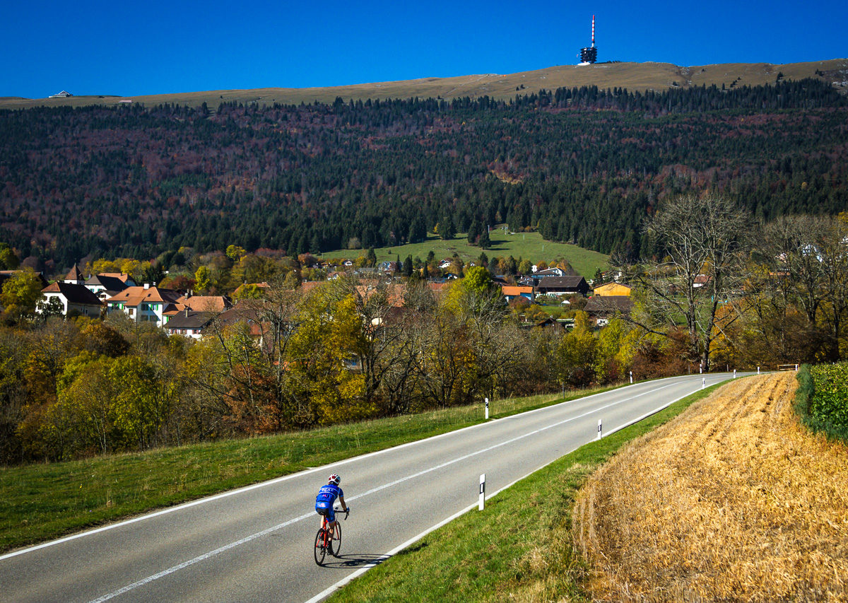 One male cyclist riding at the foot of Mont Chasseral in Kanton Bern, Switzerland