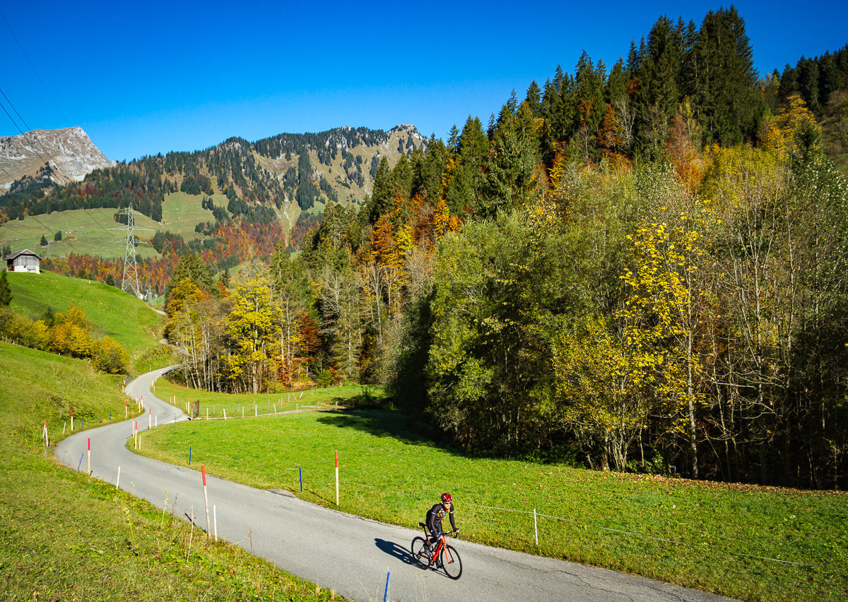 Lone cyclist climbing Mittelbergpass in Switzerland
