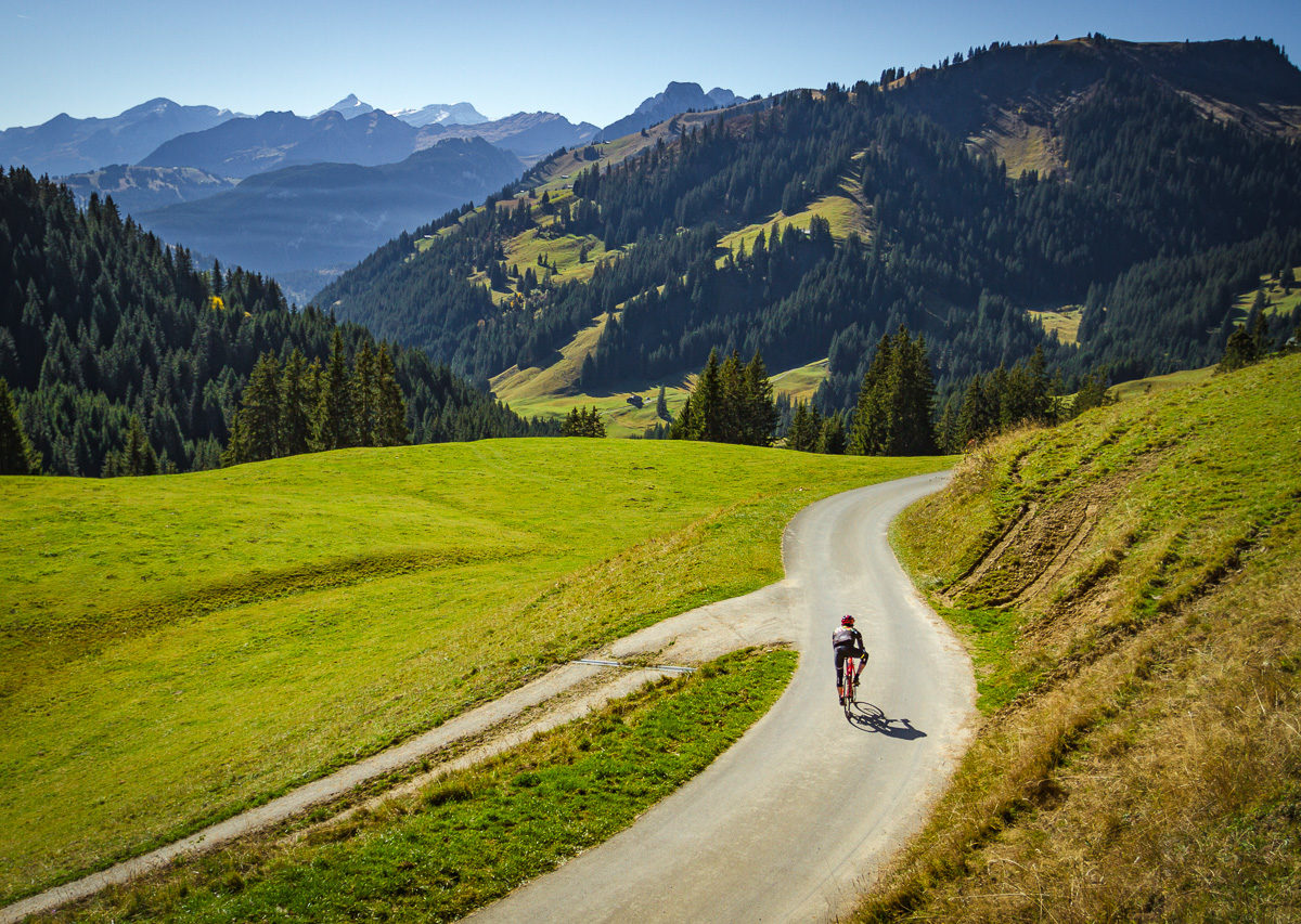 Lone cyclist descending Mittelbergpass in Switzterland