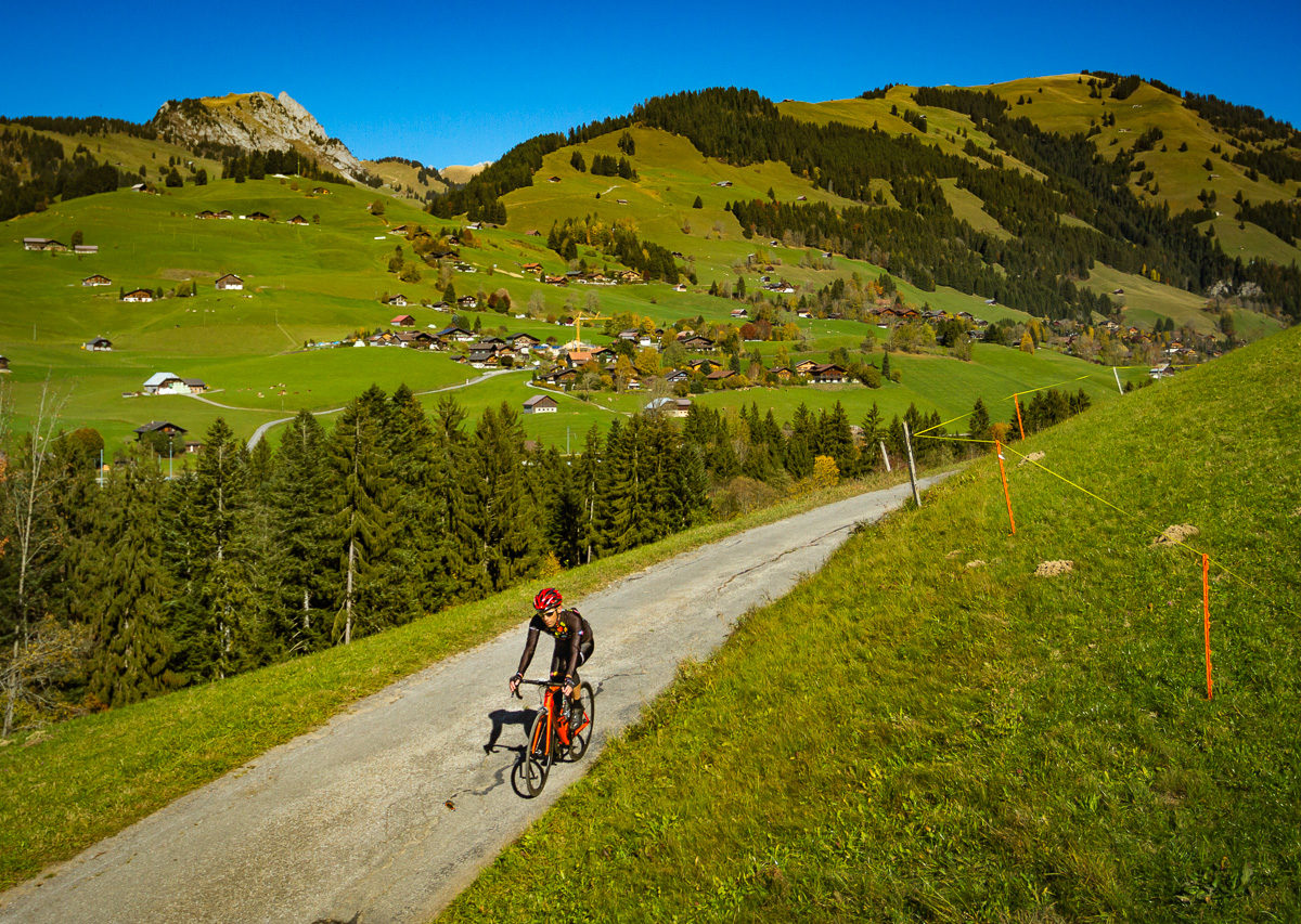 Lone cyclist riding in Pays d'Enhaut, Switzerland