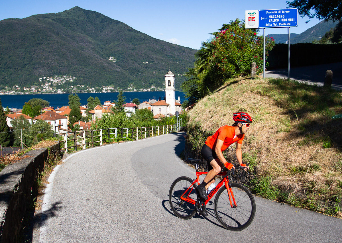 One male cyclist climbing on the Italian side of Alpe di Neggia in Ticino, Switzerland