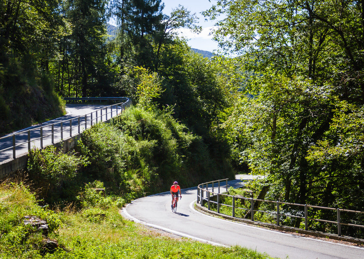 One male cyclist climbing on the Italian side of Alpe di Neggia in Ticino, Switzerland