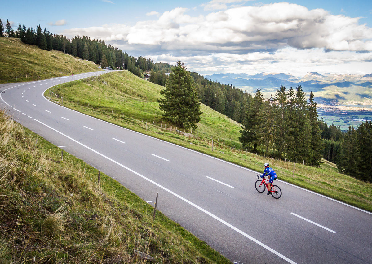 One male cyclist climbing Gurnigelpass in Kanton Bern, Switzerland