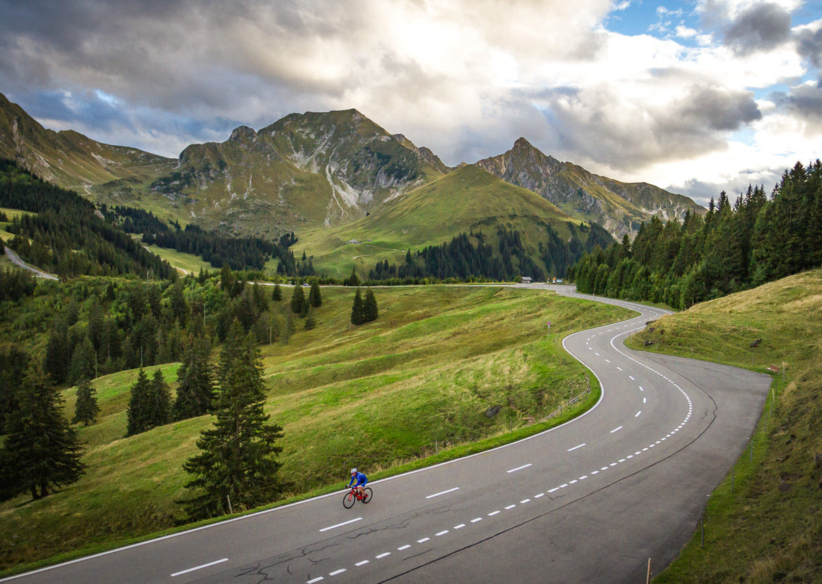 One male cyclist climbing Gurnigelpass in Kanton Bern, Switzerland