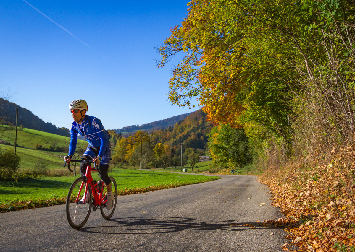 One male cyclist climbing Belchenpass in Kanton Baselland, Switzerland