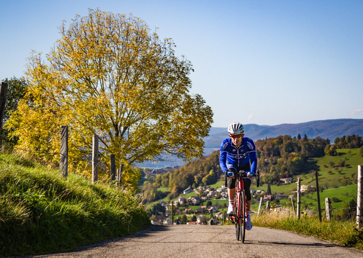 One male cyclist riding in the Jura mountains in Kanton Solothurn, Switzerland