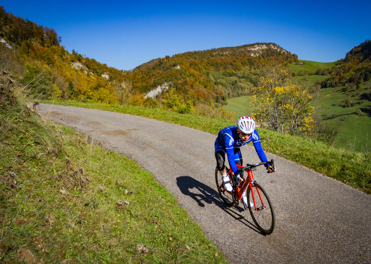 One male cyclist riding in the Jura mountains in Kanton Solothurn, Switzerland