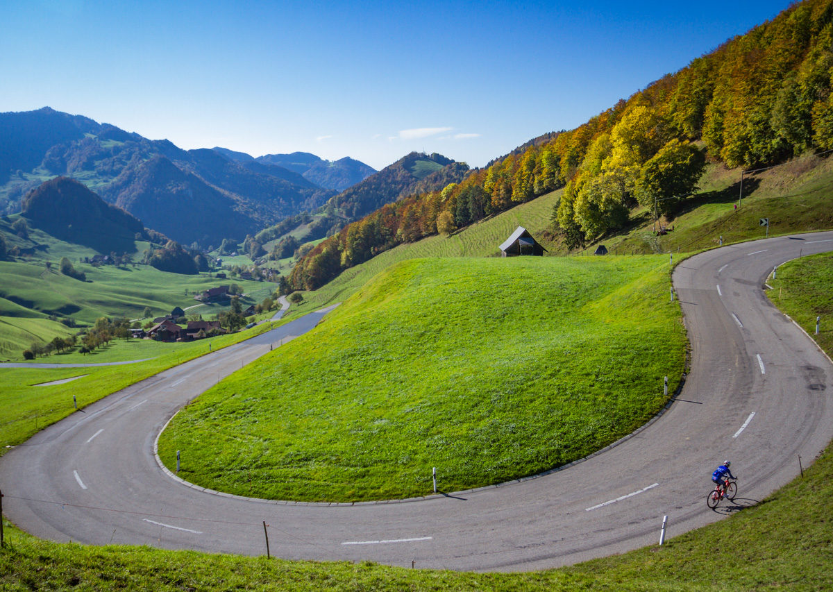 One male cyclist climbing Passwang in Kanton Solthurn, Switzerland