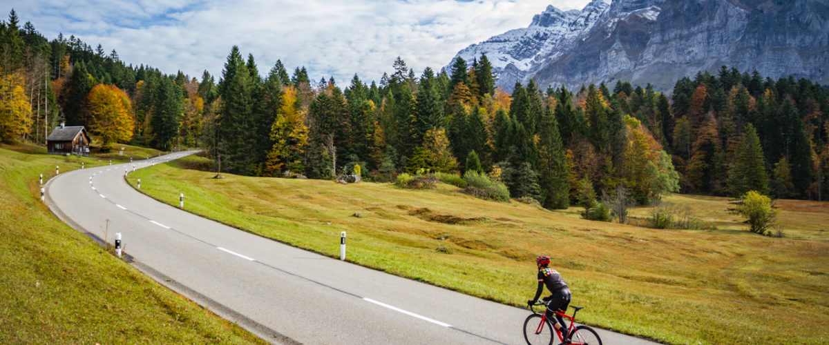 One male cyclist climbing Schwägalp in Kanton Sankt-Gallen, Switzerland