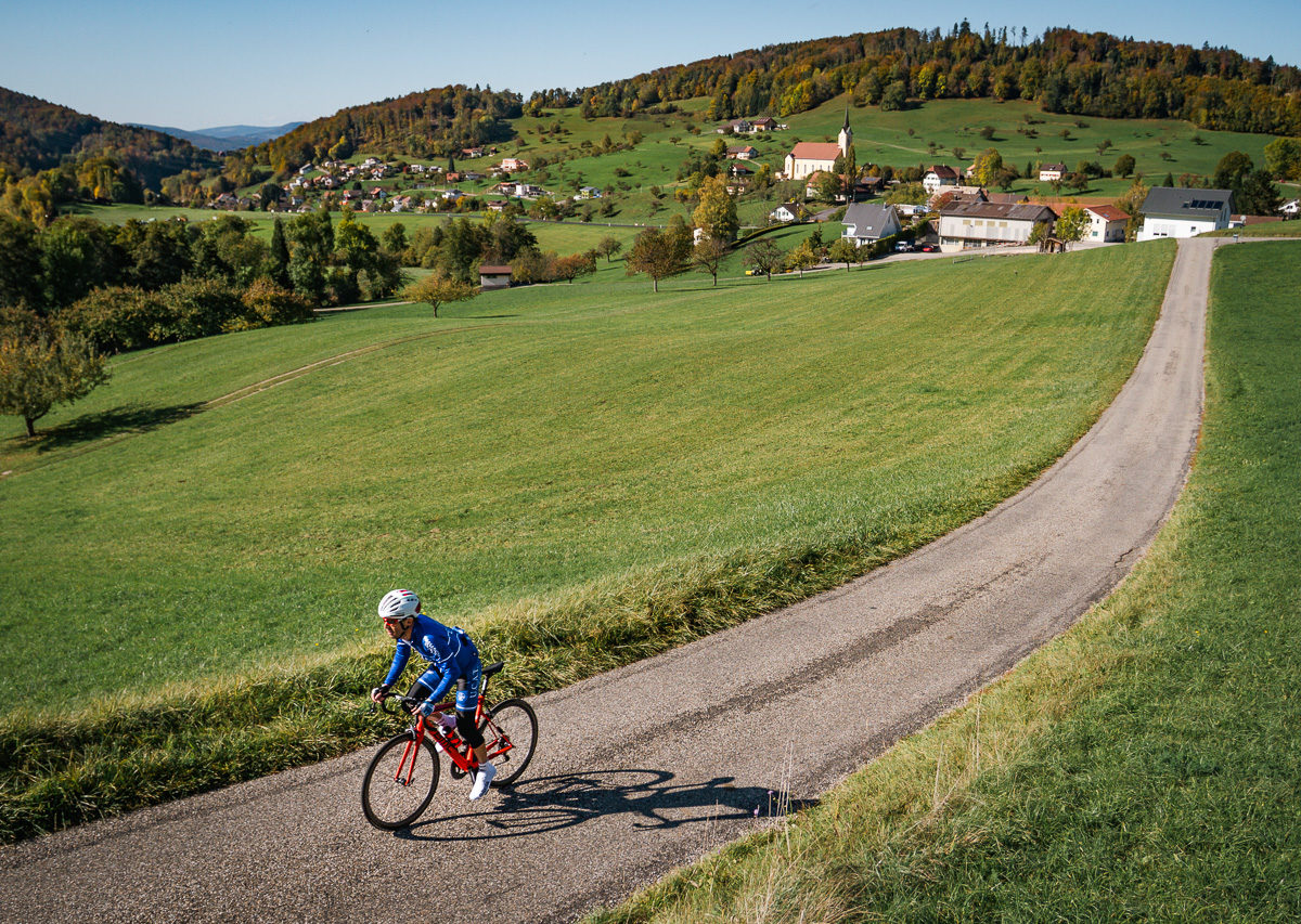 One male cyclist riding in the Jura mountains in Kanton Solothurn, Switzerland One male cyclist riding in the Jura mountains in Kanton Solothurn, Switzerland