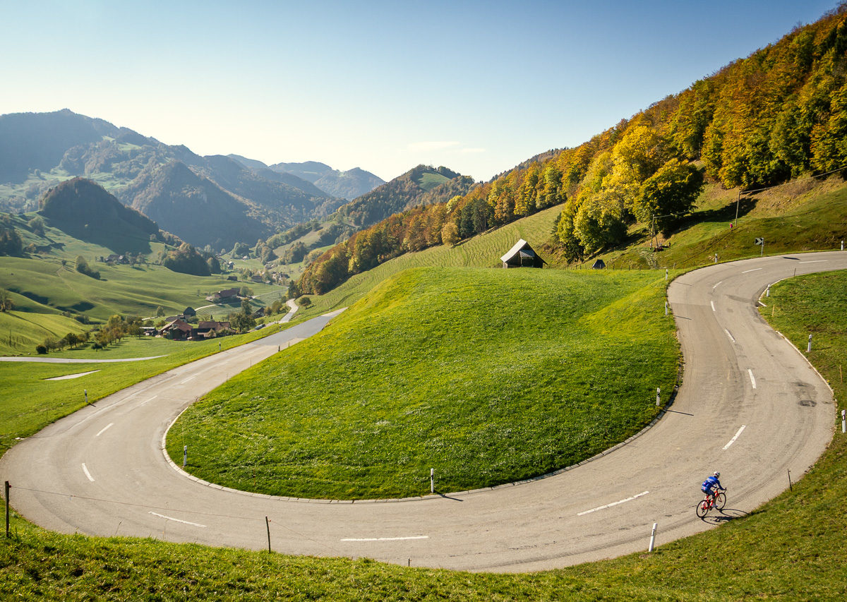 One male cyclist climbing Passwang in Kanton Solthurn, Switzerland One male cyclist climbing Passwang in Kanton Solthurn, Switzerland