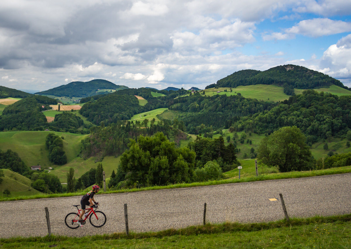 The Mittelland-7500 One male cyclist climbing Belchenpass (Jura mountains) in Kanton Baselland, Switzerland