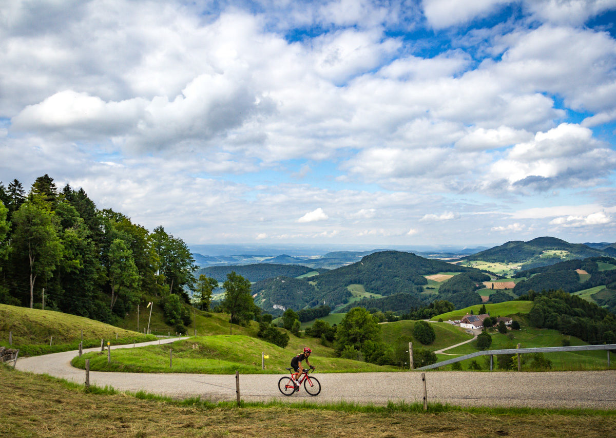 The Mittelland-7637 One male cyclist climbing Belchenpass (Jura mountains) in Kanton Baselland, Switzerland