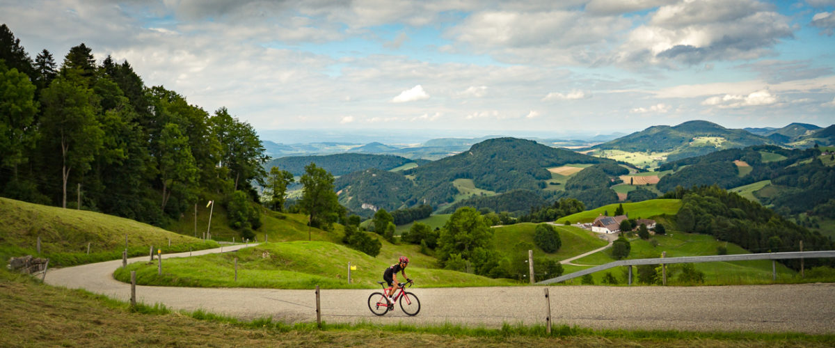Switzerland-Tourism-7637-2 One male cyclist climbing Belchenpass (Jura mountains) in Kanton Baselland, Switzerland